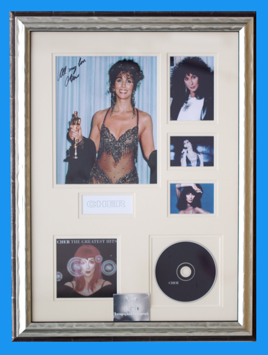 CHER - Photograph Hand Signed by Cher with CD titled ' Cher - Greatest Hits '
